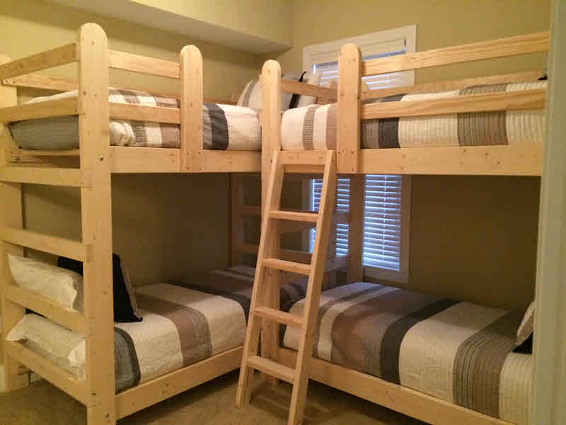 two bunk beds in small room